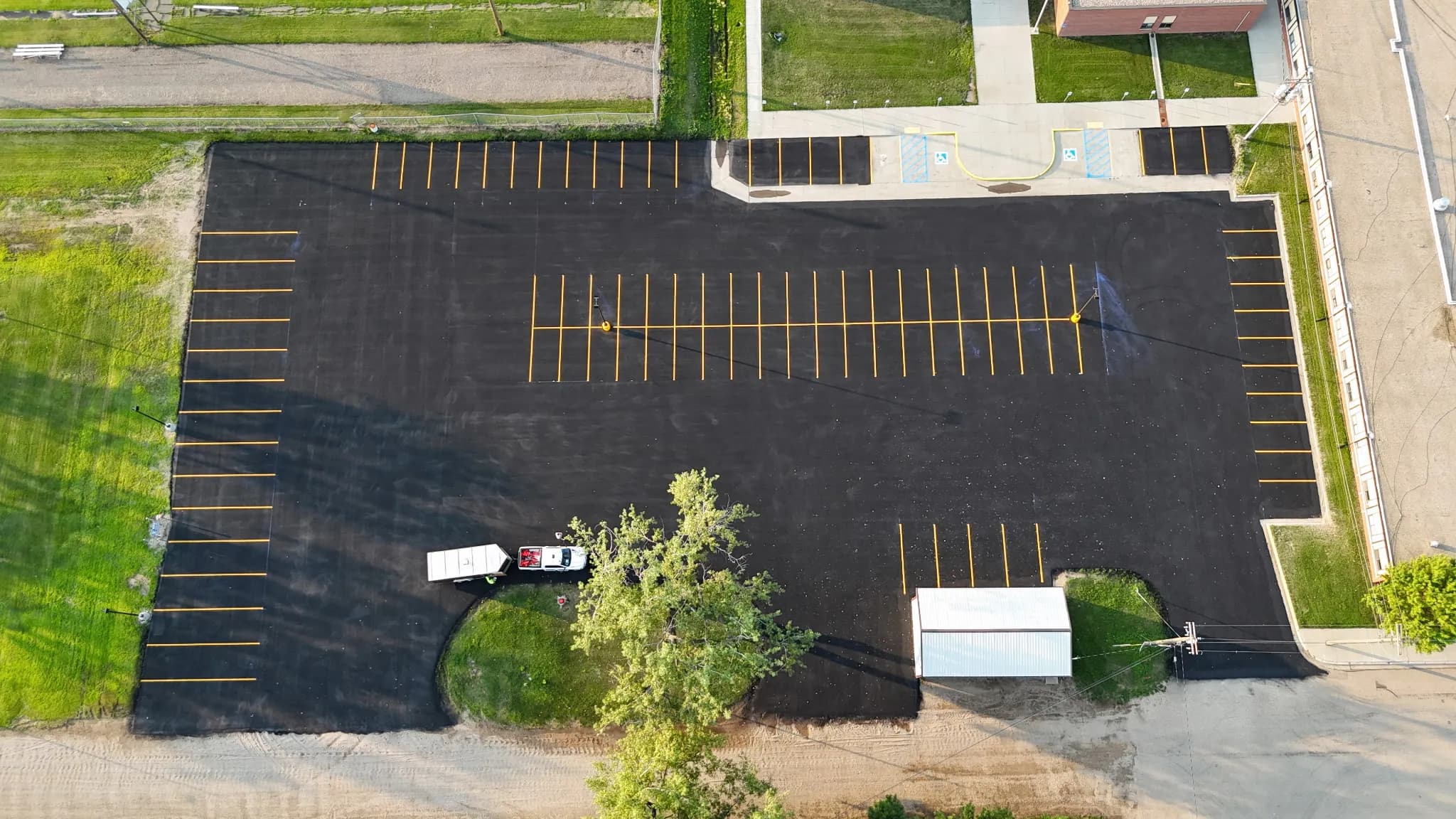 Project School parking lot sealcoating and line striping in glenburn nd image